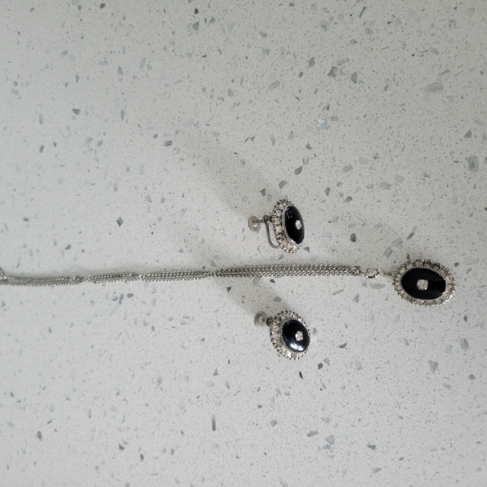 Elegant Silver and Black Necklace with Modern Charm